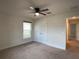 Bright bedroom featuring a ceiling fan and ample closet space at 4426 Nw 2Nd Ct, Ocala, FL 34475