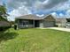 One-story house with a green exterior and a two-car garage at 4426 Nw 2Nd Ct, Ocala, FL 34475