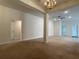 Spacious common area with high ceilings and carpet flooring at 4426 Nw 2Nd Ct, Ocala, FL 34475