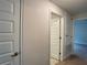 Bright hallway with neutral walls and doors at 4426 Nw 2Nd Ct, Ocala, FL 34475
