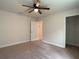 Spacious bedroom with walk-in closet and ceiling fan at 4426 Nw 2Nd Ct, Ocala, FL 34475