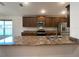 Modern kitchen with wood cabinets and granite countertops at 4426 Nw 2Nd Ct, Ocala, FL 34475