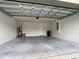 Spacious garage featuring an automatic door opener and extra storage at 4426 Nw 2Nd Ct, Ocala, FL 34475