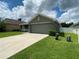 Two-car garage and well-maintained lawn at 4426 Nw 2Nd Ct, Ocala, FL 34475