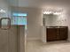 Bathroom with double vanity and walk in shower at 4426 Nw 2Nd Ct, Ocala, FL 34475