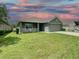 One-story house with a green exterior and a two-car garage at 4426 Nw 2Nd Ct, Ocala, FL 34475