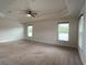 Bright and airy main bedroom with carpeted floor and multiple windows at 4426 Nw 2Nd Ct, Ocala, FL 34475