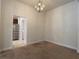 Bright dining room features a chandelier and carpet flooring at 4426 Nw 2Nd Ct, Ocala, FL 34475