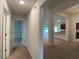 Long hallway with light walls and carpeted floor at 4426 Nw 2Nd Ct, Ocala, FL 34475