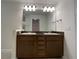 Double vanity with granite countertop and mirror at 4426 Nw 2Nd Ct, Ocala, FL 34475