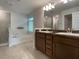 Double vanity bathroom with a soaking tub and walk-in shower at 4426 Nw 2Nd Ct, Ocala, FL 34475