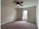 Bright bedroom with a window, ceiling fan, and carpeted floor at 4426 Nw 2Nd Ct, Ocala, FL 34475