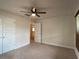 Bedroom with ceiling fan and access to another room at 4426 Nw 2Nd Ct, Ocala, FL 34475