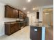 Modern kitchen with wood cabinets and granite countertops at 4426 Nw 2Nd Ct, Ocala, FL 34475