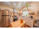 Modern kitchen with stainless steel appliances and butcher block island at 12369 Se 130Th Ct, Ocklawaha, FL 32179