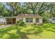 Charming single story home with a well-manicured lawn at 12369 Se 130Th Ct, Ocklawaha, FL 32179