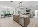 Open concept kitchen and dining area with large island and seating at 1620 Nw 73Rd Ter, Ocala, FL 34482