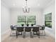 Bright dining room featuring a large, modern dining table at 1620 Nw 73Rd Ter, Ocala, FL 34482