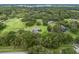 Aerial view of property with house and surrounding green space at 1620 Nw 73Rd Ter, Ocala, FL 34482