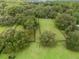 Aerial view of property showing house and expansive green pastures at 1620 Nw 73Rd Ter, Ocala, FL 34482