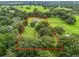 Aerial view showing a house nestled on a large lot with lush green surroundings at 1620 Nw 73Rd Ter, Ocala, FL 34482