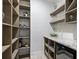 Well-organized pantry with shelving and wine cooler at 1620 Nw 73Rd Ter, Ocala, FL 34482