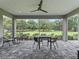 Relaxing screened patio overlooking a lush green landscape at 1620 Nw 73Rd Ter, Ocala, FL 34482