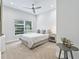Charming bedroom with garden views and ceiling fan at 1620 Nw 73Rd Ter, Ocala, FL 34482