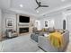Cozy living room with fireplace and large sectional sofa at 1620 Nw 73Rd Ter, Ocala, FL 34482