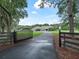 Private gated entrance leading to a charming house at 1620 Nw 73Rd Ter, Ocala, FL 34482