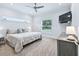 Bright bedroom featuring a king-size bed and TV at 1620 Nw 73Rd Ter, Ocala, FL 34482