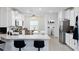 Modern kitchen with island, white cabinets and stainless steel appliances at 7531 Sw 77Th Ave, Ocala, FL 34481