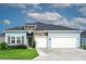 Newly built home with two-car garage and stone accents at 7531 Sw 77Th Ave, Ocala, FL 34481