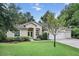 Two-story house with a two-car garage and a well-manicured lawn at 8257 Sw 196Th Court Rd, Dunnellon, FL 34432