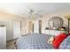 Bright bedroom featuring a ceiling fan and built-in closet at 10978 Sw 83Rd Ave, Ocala, FL 34481