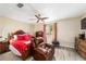 Spacious Primary bedroom with a large dresser and comfy recliner at 10978 Sw 83Rd Ave, Ocala, FL 34481