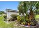 Landscaped backyard with a variety of plants and trees at 10978 Sw 83Rd Ave, Ocala, FL 34481
