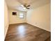 Large bedroom with ceiling fan and ample natural light at 21389 Sw 102Nd Street Rd, Dunnellon, FL 34431
