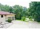 Long driveway leading to a two-car garage at 21389 Sw 102Nd Street Rd, Dunnellon, FL 34431