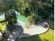 Sandy beach access to a clear spring with stairs and railings at 21389 Sw 102Nd Street Rd, Dunnellon, FL 34431