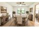 Dining room featuring a rustic farmhouse table and neutral decor at 21389 Sw 102Nd Street Rd, Dunnellon, FL 34431