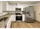 Kitchen with stainless steel appliances and granite countertops at 21389 Sw 102Nd Street Rd, Dunnellon, FL 34431