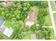 Aerial view of single-story home with large backyard and surrounding trees at 21389 Sw 102Nd Street Rd, Dunnellon, FL 34431