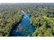 Aerial view of a crystal-clear river in a wooded area at 21389 Sw 102Nd Street Rd, Dunnellon, FL 34431