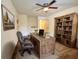 Home office featuring built-in wooden shelving and large desk at 21389 Sw 102Nd Street Rd, Dunnellon, FL 34431