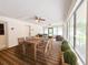 Relaxing screened porch with dining area and seating at 21389 Sw 102Nd Street Rd, Dunnellon, FL 34431
