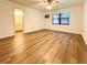Bedroom with ensuite bathroom and wood-look floors at 21389 Sw 102Nd Street Rd, Dunnellon, FL 34431