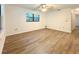 Spacious bedroom with wood-look floors and a ceiling fan at 21389 Sw 102Nd Street Rd, Dunnellon, FL 34431