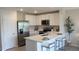 Modern kitchen featuring white cabinets, stainless steel appliances, and an island at 6599 Sw 81St Loop, Ocala, FL 34476