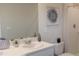 Clean bathroom with single vanity and shower at 6609 Sw 81St Loop, Ocala, FL 34476